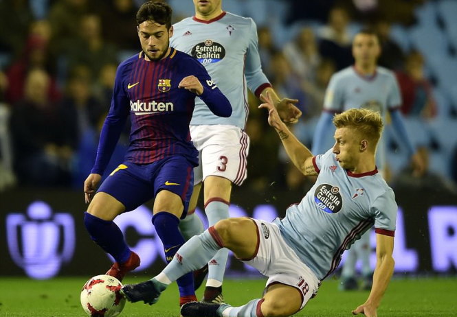 Barca (trái) bị chủ nhà Celta Vigo cầm chân ở lượt đi vòng 16 đội Cúp nhà vua Tây Ban Nha. Ảnh: AFP