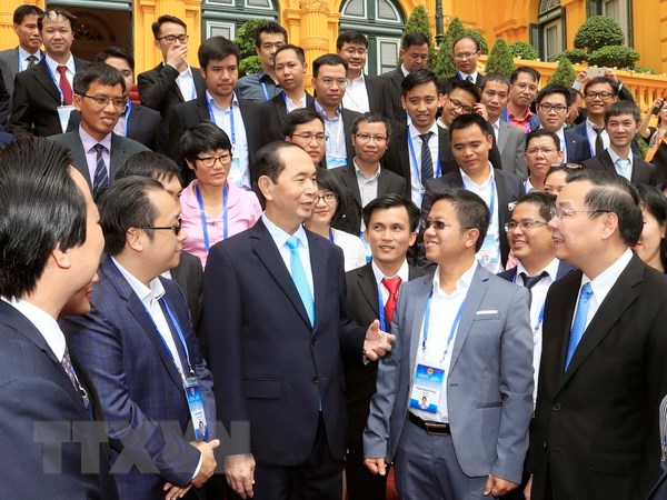 Chủ tịch nước Trần Đại Quang gặp mặt thân mật Đoàn đại biểu người Việt tài tăng trong lĩnh vực khoa học và công nghệ. (Ảnh: Nhan Sáng/TTXVN)