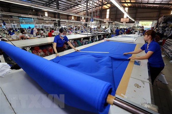 Hiệp định CPTPP chính thức có hiệu lực đối với Việt Nam từ 14/1 CPTPP được kỳ vọng sẽ tạo cú hích cho nhiều ngành hàng của Việt Nam, trong đó có ngành dệt may. (Ảnh: Danh Lam/TTXVN)
