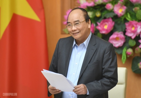Thủ tướng động viên đội tuyển Việt Nam trước trận đấu với Jordan. 