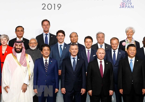 Thủ tướng Nguyễn Xuân Phúc và các trưởng đoàn tham dự hội nghị G20 chụp ảnh chung. (Ảnh: Thống Nhất/TTXVN)