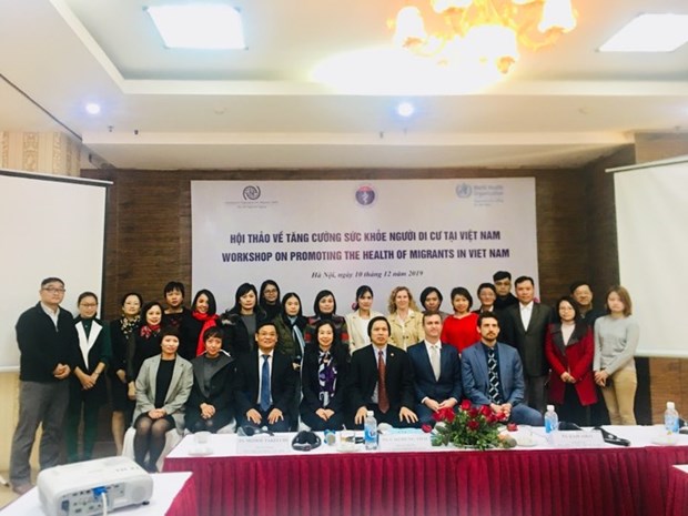 Workshop discusses migrants’ health in Vietnam Participants in the workshop pose for a photo (Photo: suckhoedoisong.vn)