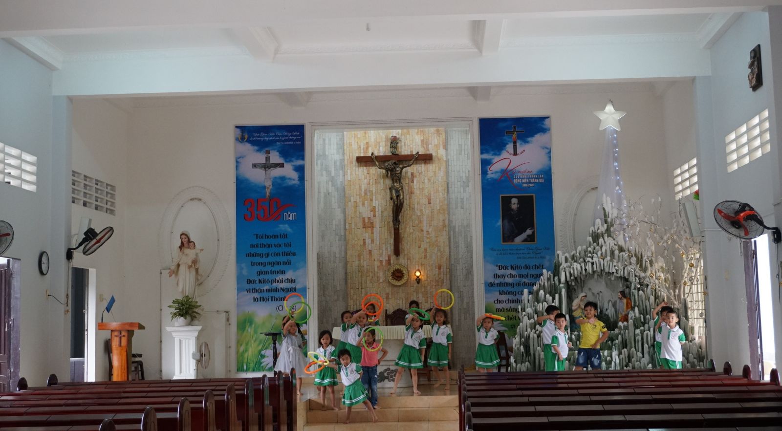 Children practice music to prepare for the Christmas season