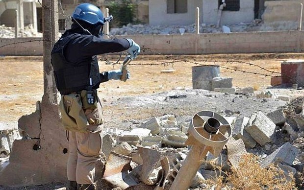 Vietnam condemns use of chemical weapons: ambassador A UN staff member studying chemical weapons in Syria in 2013. (File photo of AP)