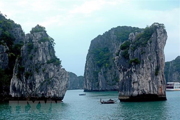 Tourism sector busy on holidays after social distancing eased Ha Long Bay (Source: VNA)