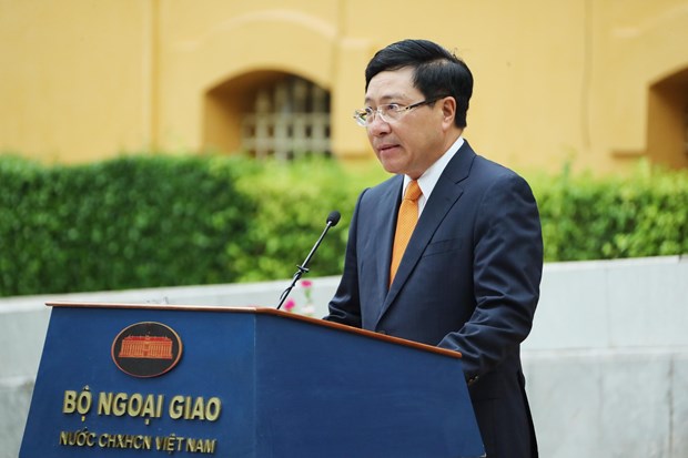 Speech by Deputy PM Pham Binh Minh at ASEAN flag hoisting ceremony Deputy Prime Minister and Foreign Minister Pham Binh Minh addresses the ASEAN flag hoisting ceremony in Hanoi on August 7 (Photo: VNA)