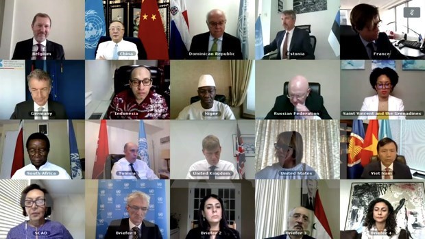 Participants at the meeting (Photo: VNA)