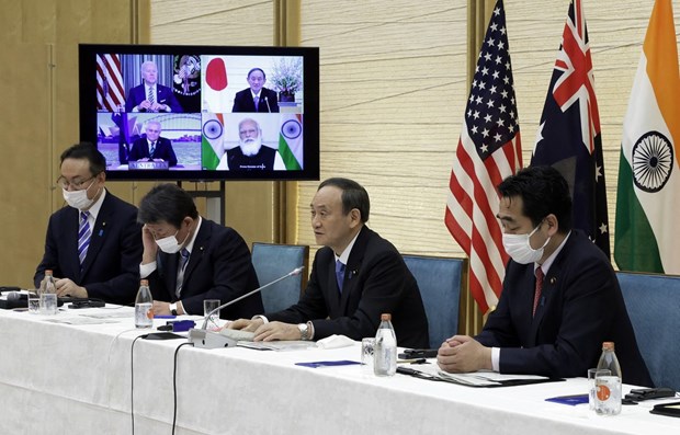Japanese PM proposes more cooperation between Quad and ASEAN countries Japanese Prime Minister Yoshihide Suga (second, right) speaks at the virtual Quad summit on March 12 (Photo: AFP/VNA)