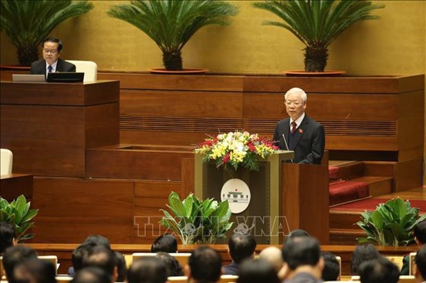 Party General Secretary and State President Nguyen Phu Trong delivers the report on the President's performance during 2016-2021 at the opening sitting of the NA's 11th session on March 24 (Photo: VNA)