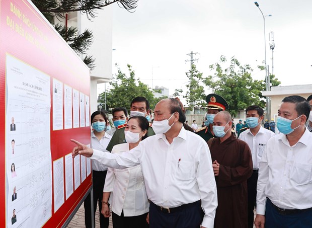 Absolute safety ensured for upcoming general elections President Nguyen Xuan Phuc looks at a list of NA deputy candidates posted in Trung Chanh commune, Hoc Mon district, HCM City. (Photo: VNA)