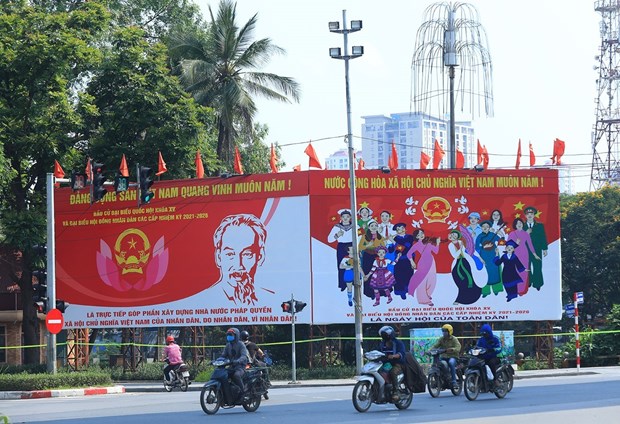 Vietnam bright spot in NA deputy composition diversity: expert Banners on the election on a street in Vietnam (Photo: VNA)