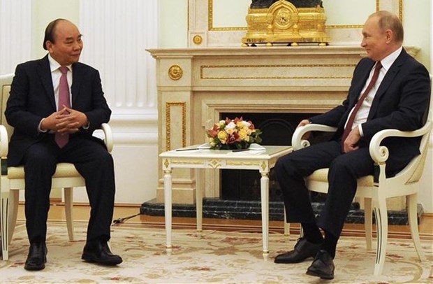 Vietnamese President Nguyen Xuan Phuc (left) and his Russian counterpart Vladimir Putin. (Photo: VNA)