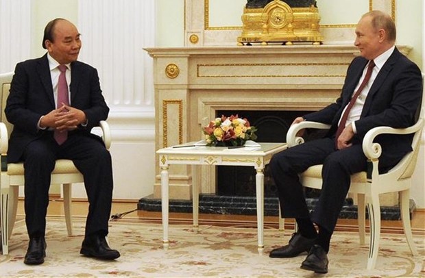 Russia, Vietnam strive to further promote partnership: Russian media Vietnamese President Nguyen Xuan Phuc (left) and his Russian counterpart Vladimir Putin. (Photo: VNA)