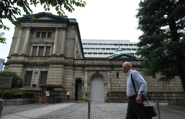 Ngân hàng trung ương Nhật Bản sẽ tiếp tục bơm hàng chục tỷ USD vào nền kinh tế. (Ảnh: AFP/TTXVN)