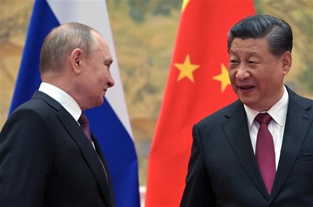 Chủ tịch Trung Quốc Tập Cận Bình (phải) và Tổng thống Nga Vladimir Putin tại cuộc gặp ở Bắc Kinh (Trung Quốc), ngày 4/2/2022. (Ảnh: AFP/TTXVN)