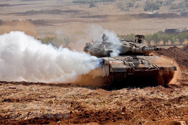 Xe tăng Merkava của quân đội Israel tham gia cuộc tập trận ở vùng Thượng Galilee, miền Bắc Israel. (Ảnh: AFP/TTXVN)